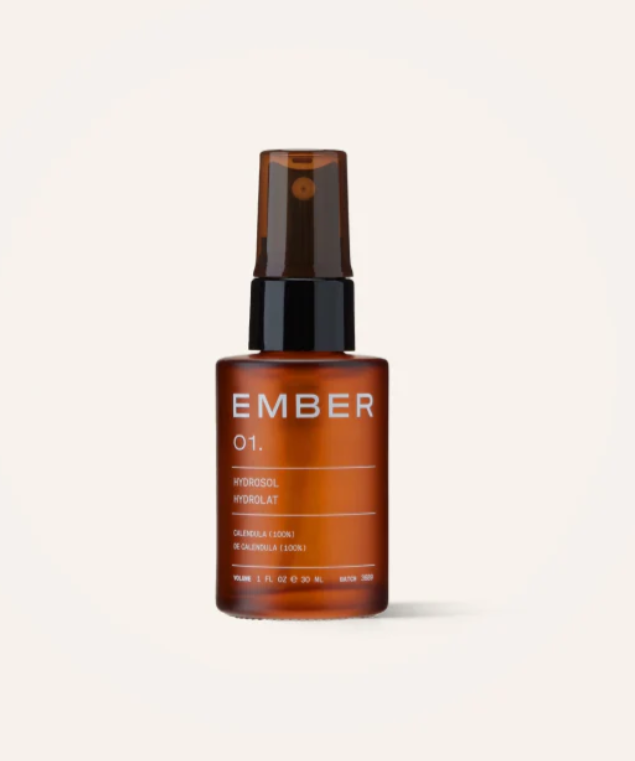 Facial hydrosol in a glass amber bottle with a spray top. 