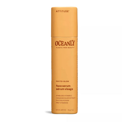 Light orange deodorant-stick-shaped container with dark orange text, labelled as Face Serum, from ATTITUDE's Oceanly, Phyto-Glow line.