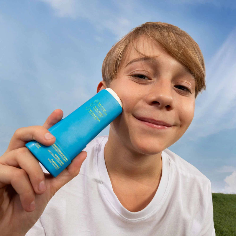 Photograph of child using Kids Mineral Sunscreen Face Stick SPF 30, from ATTITUDE&