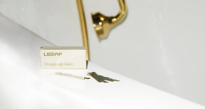 A box labelled "LEAF 50 single edge blades" sits on a white counter with 3 loose blades in front of it.
