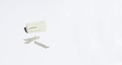 A box labelled "LEAF 50 single edge blades" sits on a white counter with 3 loose blades in front of it.