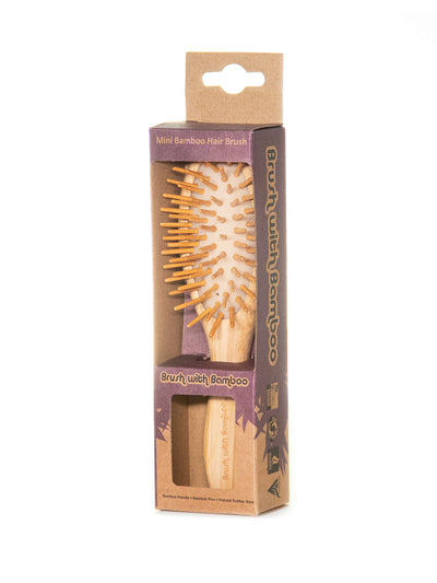 mini bamboo hairbrush in its packaging 